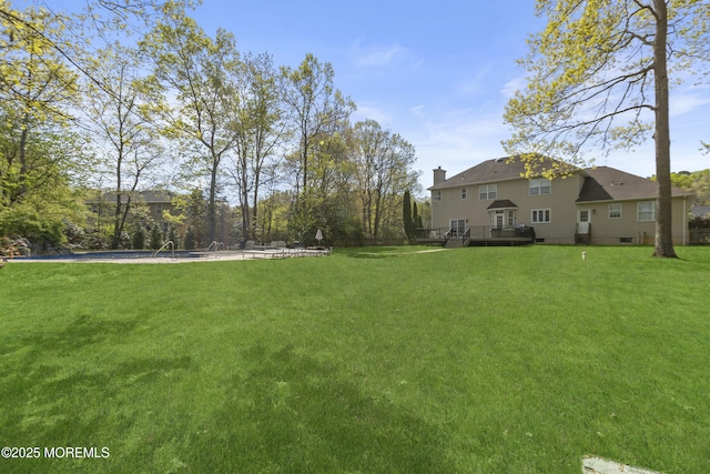 view of yard with a wooden deck