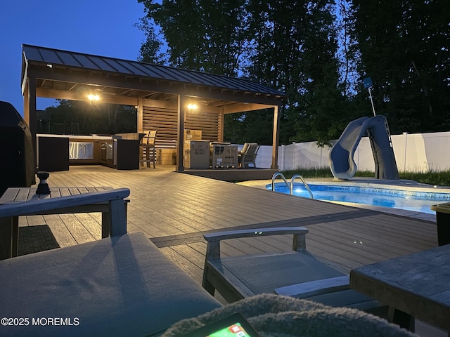 4 Christopher Dr, Howell, NJ 07731 - wooden terrace with outdoor dry bar, fence, a fenced in pool, and area for grilling