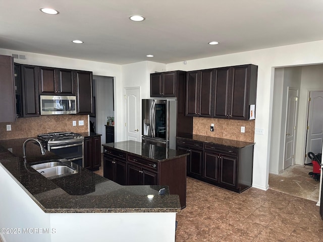 4 Christopher Dr, Howell, NJ 07731 - kitchen featuring dark stone counters, a sink, decorative backsplash, stainless steel appliances, and visible vents
