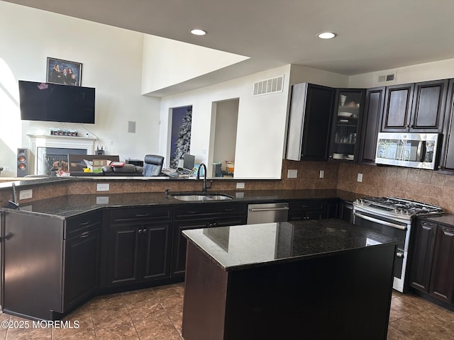 4 Christopher Dr, Howell, NJ 07731 - kitchen featuring visible vents, dark stone countertops, stainless steel appliances, and a sink
