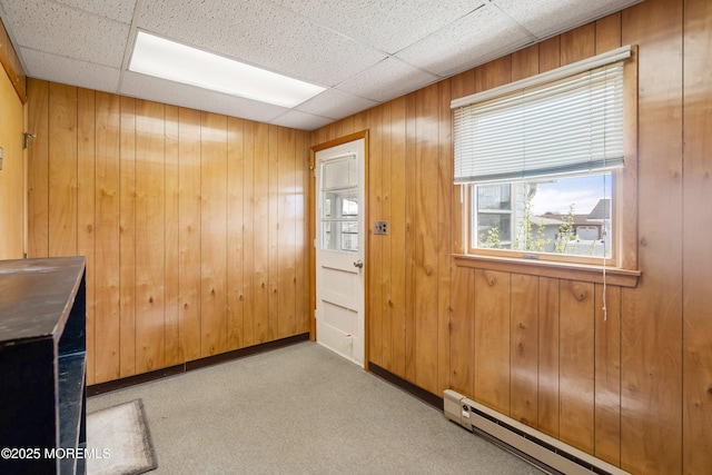 37 Central Blvd, Brick, NJ 08724 - spare room featuring a paneled ceiling, baseboards, carpet, baseboard heating, and wooden walls