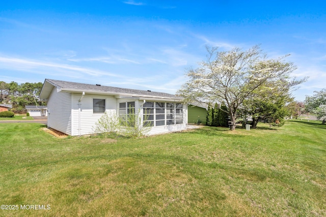 37 Central Blvd, Brick, NJ 08724 - rear view of house featuring a sunroom and a lawn