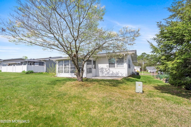 37 Central Blvd, Brick, NJ 08724 - view of front of home with a front lawn, a sunroom, and fence