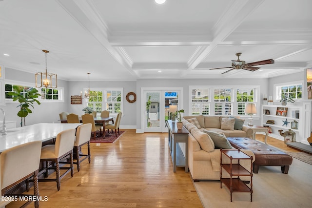 living area featuring ornamental molding, beamed ceiling, light wood-type flooring, recessed lighting, and coffered ceiling