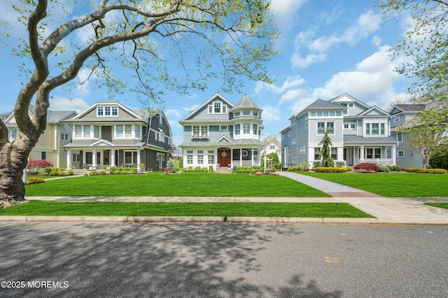 view of front of property featuring a residential view and a front yard