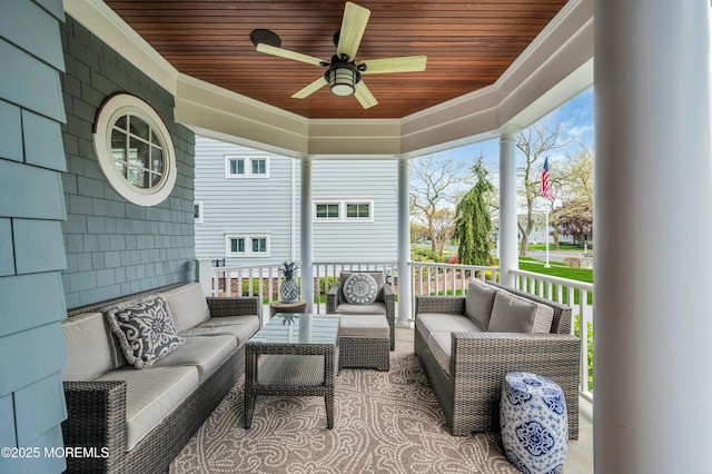 sunroom featuring ceiling fan and outdoor lounge area
