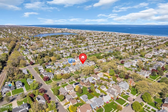 aerial view featuring a water view and a residential view