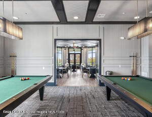 rec room with recessed lighting, coffered ceiling, a decorative wall, and pool table