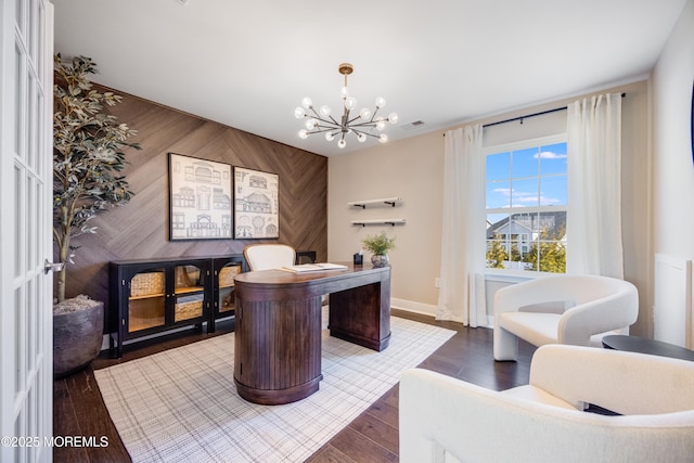 office space featuring baseboards, a chandelier, visible vents, and dark wood-type flooring