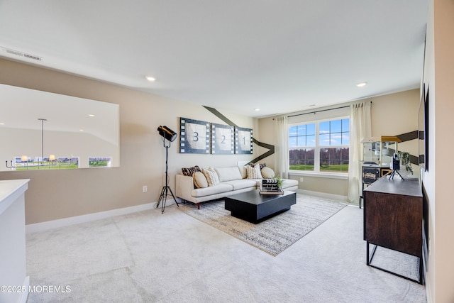 living area featuring recessed lighting, carpet, baseboards, visible vents, and a chandelier