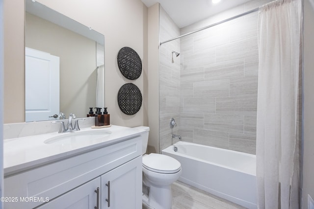 full bathroom with shower / bathtub combination with curtain, toilet, and vanity