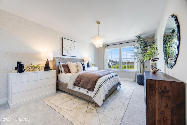 bedroom featuring light carpet, baseboards, and a notable chandelier