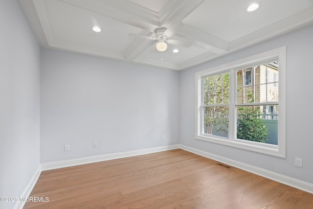 spare room featuring coffered ceiling, a ceiling fan, light wood finished floors, and baseboards