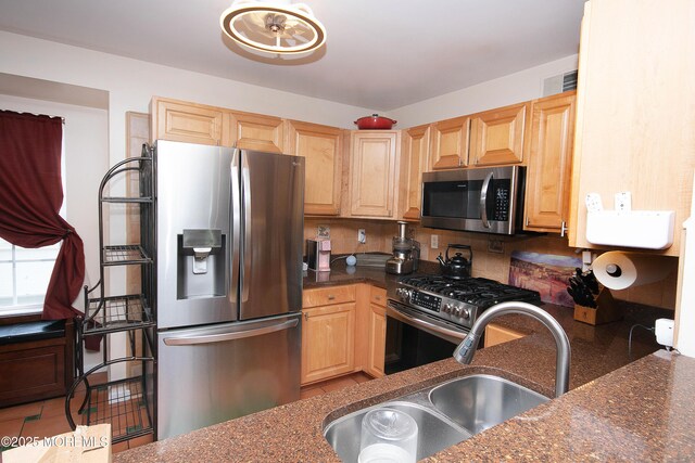 83 Nathan Blvd Unit 35, Sayreville, NJ 08859 - kitchen with a sink, stainless steel appliances, light brown cabinetry, and visible vents