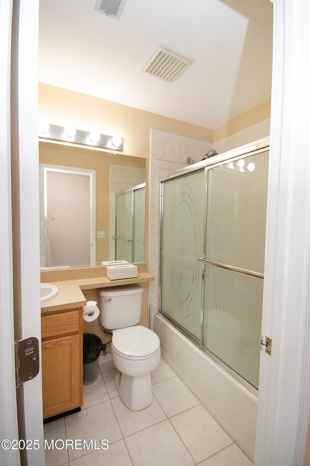 83 Nathan Blvd Unit 35, Sayreville, NJ 08859 - bathroom with enclosed tub / shower combo, toilet, visible vents, tile patterned flooring, and vanity