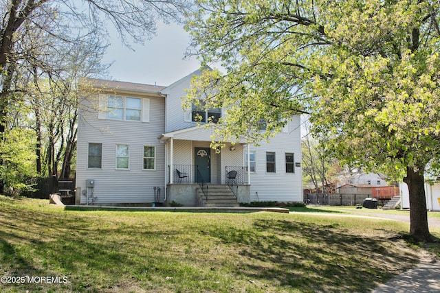 1150 Buckwald Ct, Lakewood, NJ 08701 - traditional-style home featuring fence and a front lawn