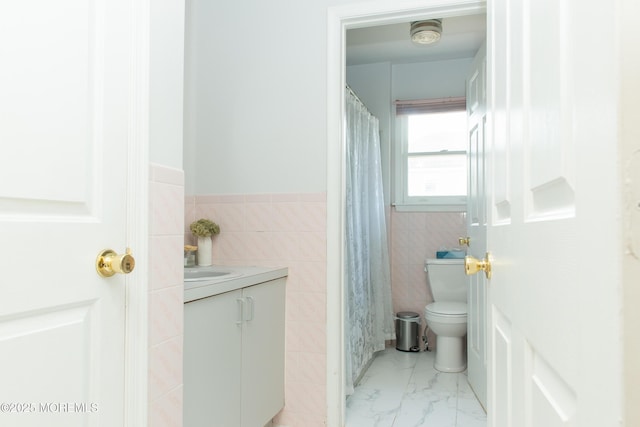 1150 Buckwald Ct, Lakewood, NJ 08701 - full bath featuring toilet, tile walls, vanity, marble finish floor, and wainscoting