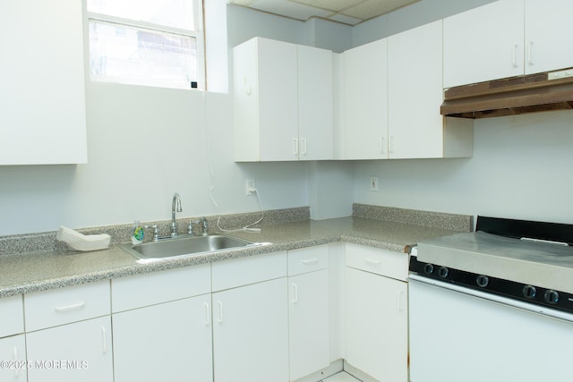 1150 Buckwald Ct, Lakewood, NJ 08701 - kitchen featuring white cabinets, a sink, white gas range, light countertops, and under cabinet range hood