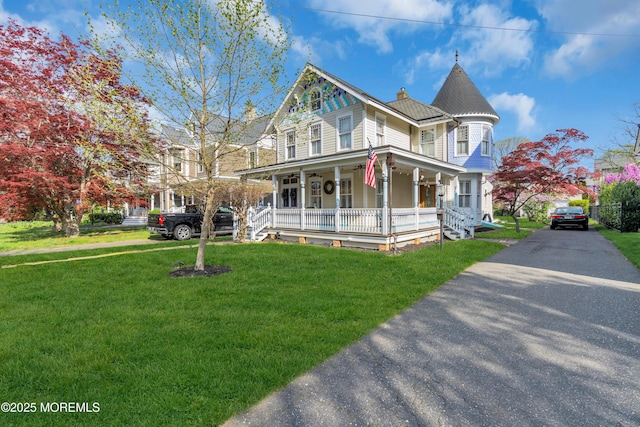 44 Irving Pl, Red Bank, NJ 07701 - victorian home featuring a porch, a front lawn, and a chimney