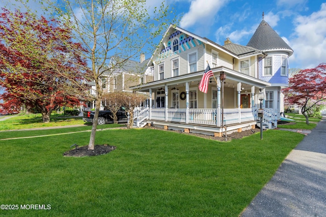 44 Irving Pl, Red Bank, NJ 07701 - victorian home featuring a chimney, a front yard, and covered porch