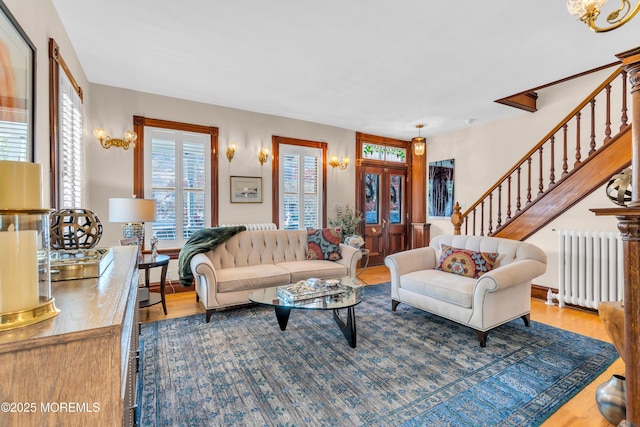 44 Irving Pl, Red Bank, NJ 07701 - living room featuring stairway, radiator, and wood finished floors