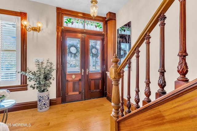 44 Irving Pl, Red Bank, NJ 07701 - entryway featuring light wood-style flooring, a wealth of natural light, stairway, and french doors