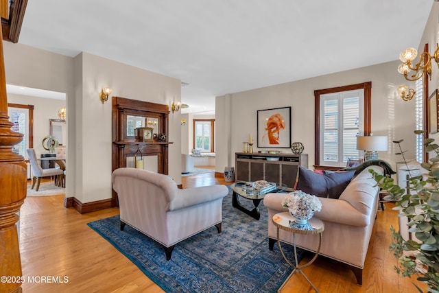 44 Irving Pl, Red Bank, NJ 07701 - living area with baseboards, wood finished floors, and a chandelier