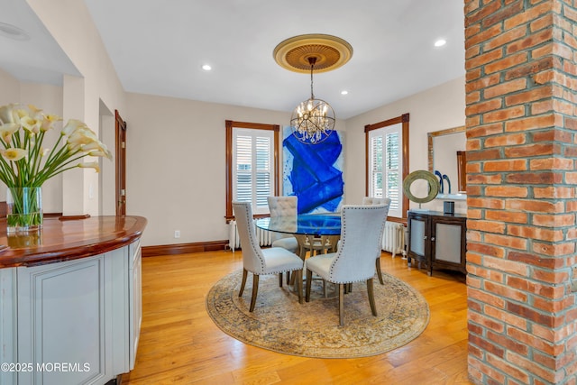 44 Irving Pl, Red Bank, NJ 07701 - dining area featuring light wood finished floors, baseboards, a notable chandelier, and radiator