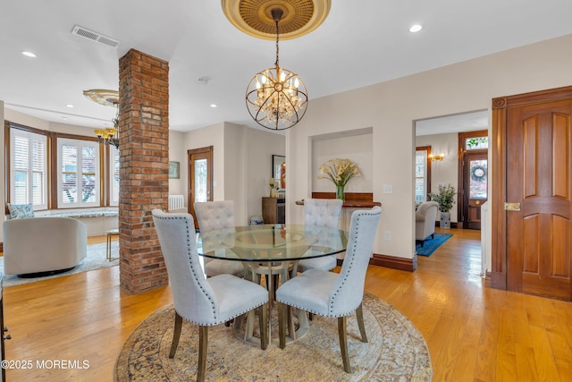 44 Irving Pl, Red Bank, NJ 07701 - dining area featuring decorative columns, light wood-style flooring, a notable chandelier, visible vents, and recessed lighting