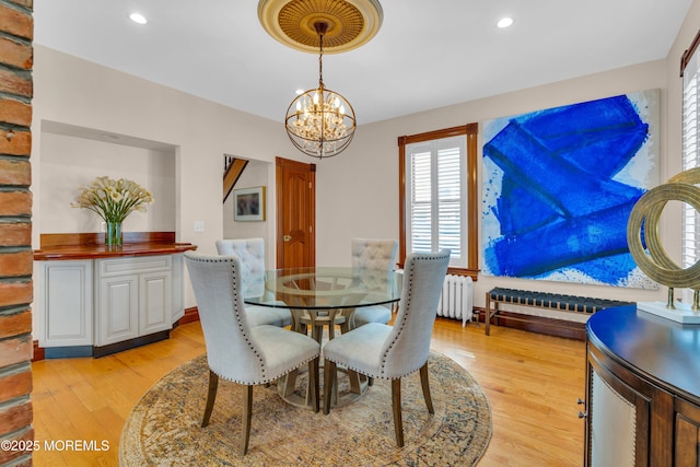 44 Irving Pl, Red Bank, NJ 07701 - dining space featuring recessed lighting, radiator heating unit, light wood-style flooring, and a notable chandelier