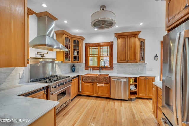 44 Irving Pl, Red Bank, NJ 07701 - kitchen featuring light wood finished floors, stainless steel appliances, light countertops, a sink, and tasteful backsplash