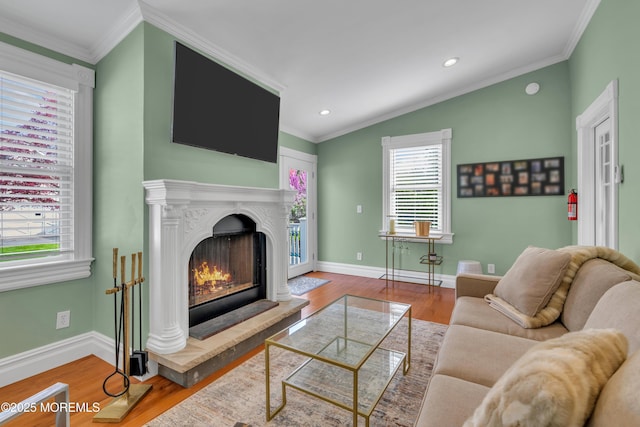 44 Irving Pl, Red Bank, NJ 07701 - living area featuring recessed lighting, a warm lit fireplace, wood finished floors, and a wealth of natural light
