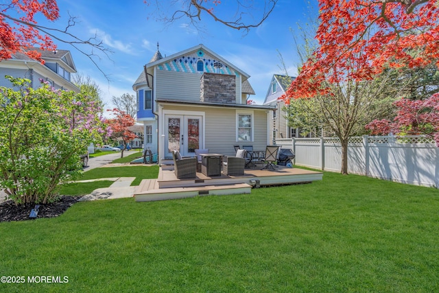 44 Irving Pl, Red Bank, NJ 07701 - back of property with a lawn, fence, a deck, and outdoor lounge area