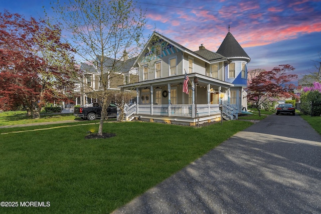 44 Irving Pl, Red Bank, NJ 07701 - victorian home with a yard, a porch, a chimney, and aphalt driveway