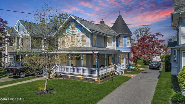 44 Irving Pl, Red Bank, NJ 07701 - victorian house with a front lawn and covered porch