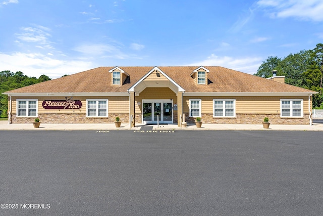26 Dogwood Dr, Barnegat, NJ 08005 - view of front of house featuring stone siding, french doors, and a shingled roof