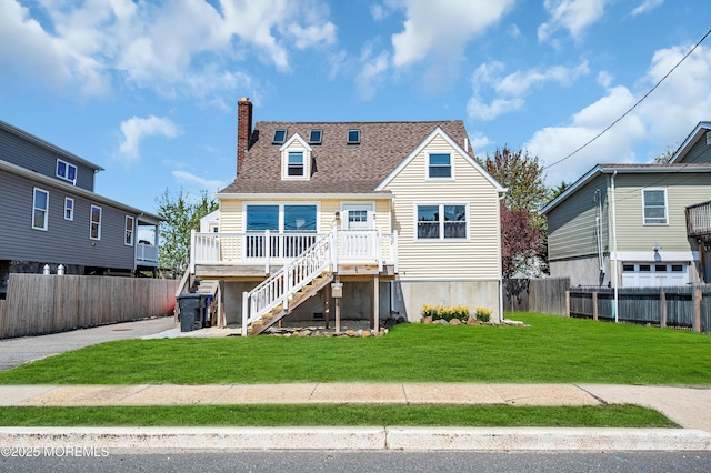 316 Rte 37, Seaside Heights, NJ 08751 - rear view of house featuring a chimney, a shingled roof, a lawn, fence, and stairway