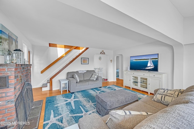 316 Rte 37, Seaside Heights, NJ 08751 - living area featuring arched walkways, stairway, wood finished floors, and baseboards