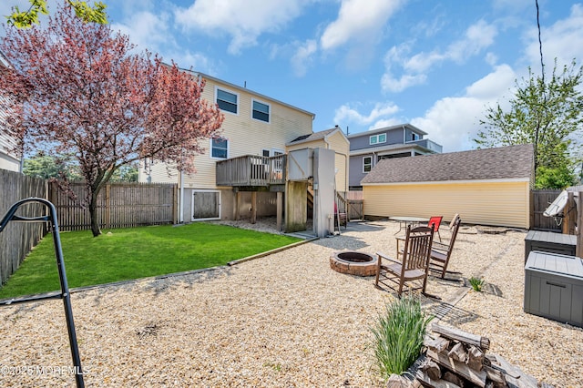 316 Rte 37, Seaside Heights, NJ 08751 - rear view of property featuring a deck, an outdoor fire pit, a fenced backyard, and a yard