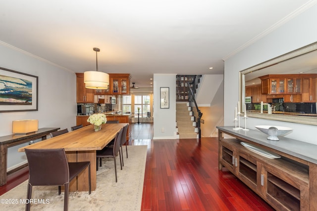 dining area with crown molding, stairs, recessed lighting, baseboards, and wood finished floors