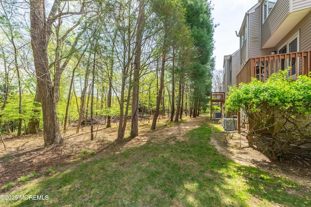 view of yard featuring a wooden deck