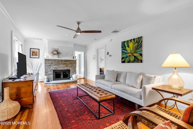 109 Capstan Ave, Beachwood, NJ 08722 - living room with ceiling fan, wood-type flooring, crown molding, and a fireplace