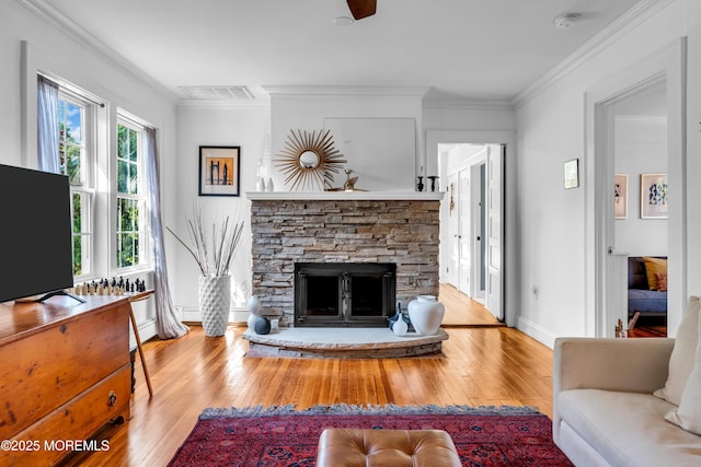 109 Capstan Ave, Beachwood, NJ 08722 - living room with hardwood / wood-style flooring, a fireplace, a ceiling fan, baseboards, and ornamental molding