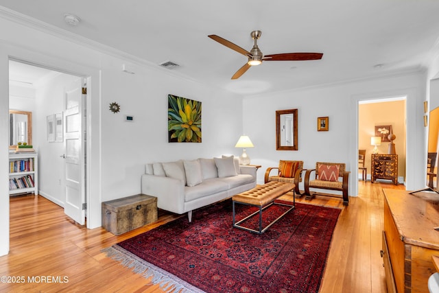 109 Capstan Ave, Beachwood, NJ 08722 - living room with ceiling fan, crown molding, and light wood finished floors