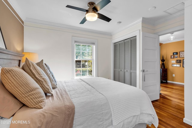 109 Capstan Ave, Beachwood, NJ 08722 - bedroom featuring crown molding, wood finished floors, a closet, baseboards, and ceiling fan