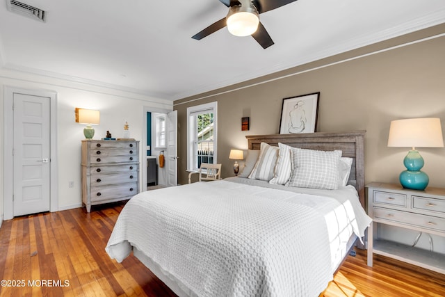 109 Capstan Ave, Beachwood, NJ 08722 - bedroom featuring hardwood / wood-style floors, ornamental molding, a ceiling fan, and baseboards