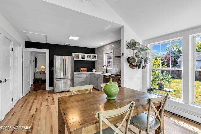 109 Capstan Ave, Beachwood, NJ 08722 - dining room featuring attic access, light wood-style flooring, and healthy amount of natural light