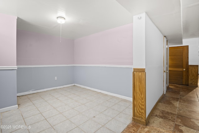 empty room with baseboards