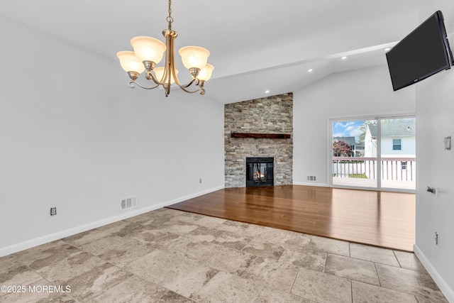 unfurnished living room featuring an inviting chandelier, baseboards, stone finish floor, and visible vents