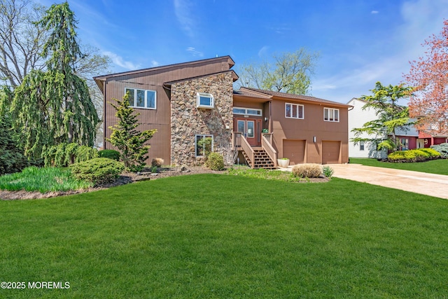 view of front of house featuring concrete driveway, a garage, a front lawn, and stone siding